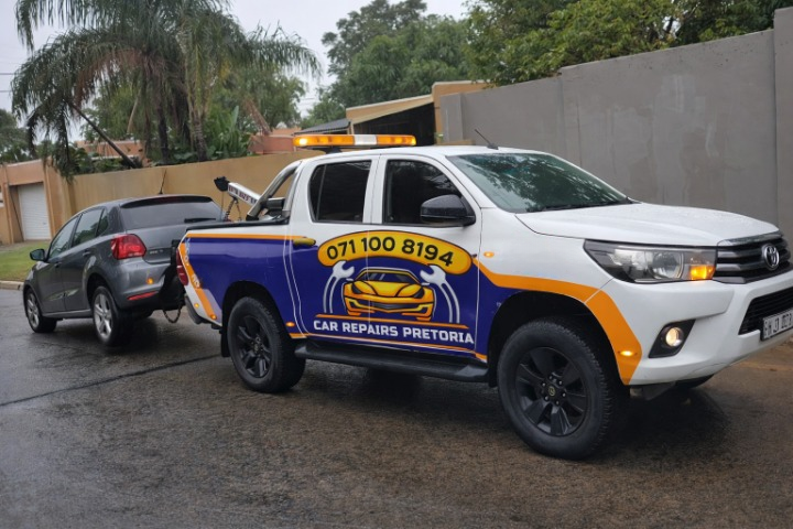 Tow truck assisting a broken-down vehicle